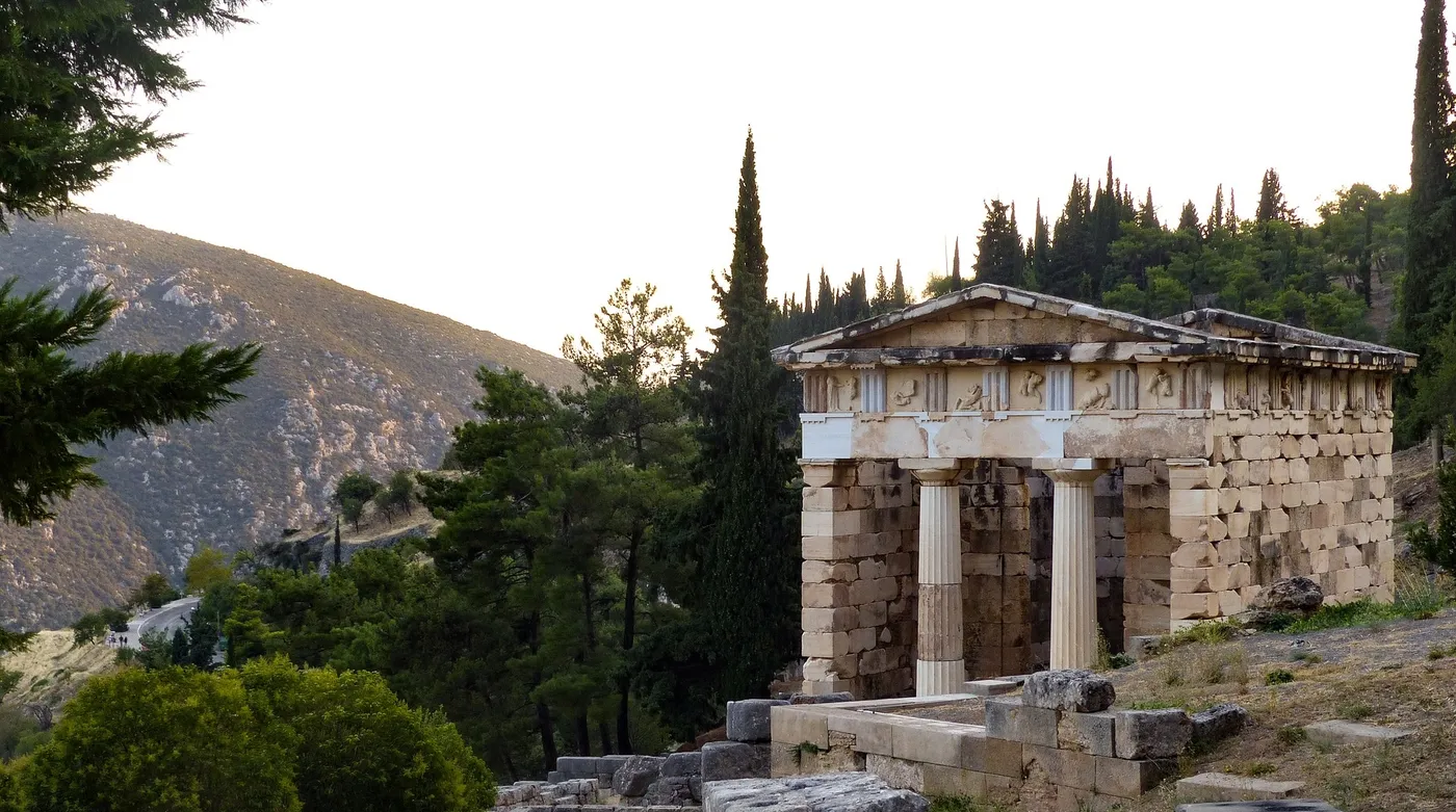 The reconstructed Treasury of the Athenians among the cypresses at Delphi