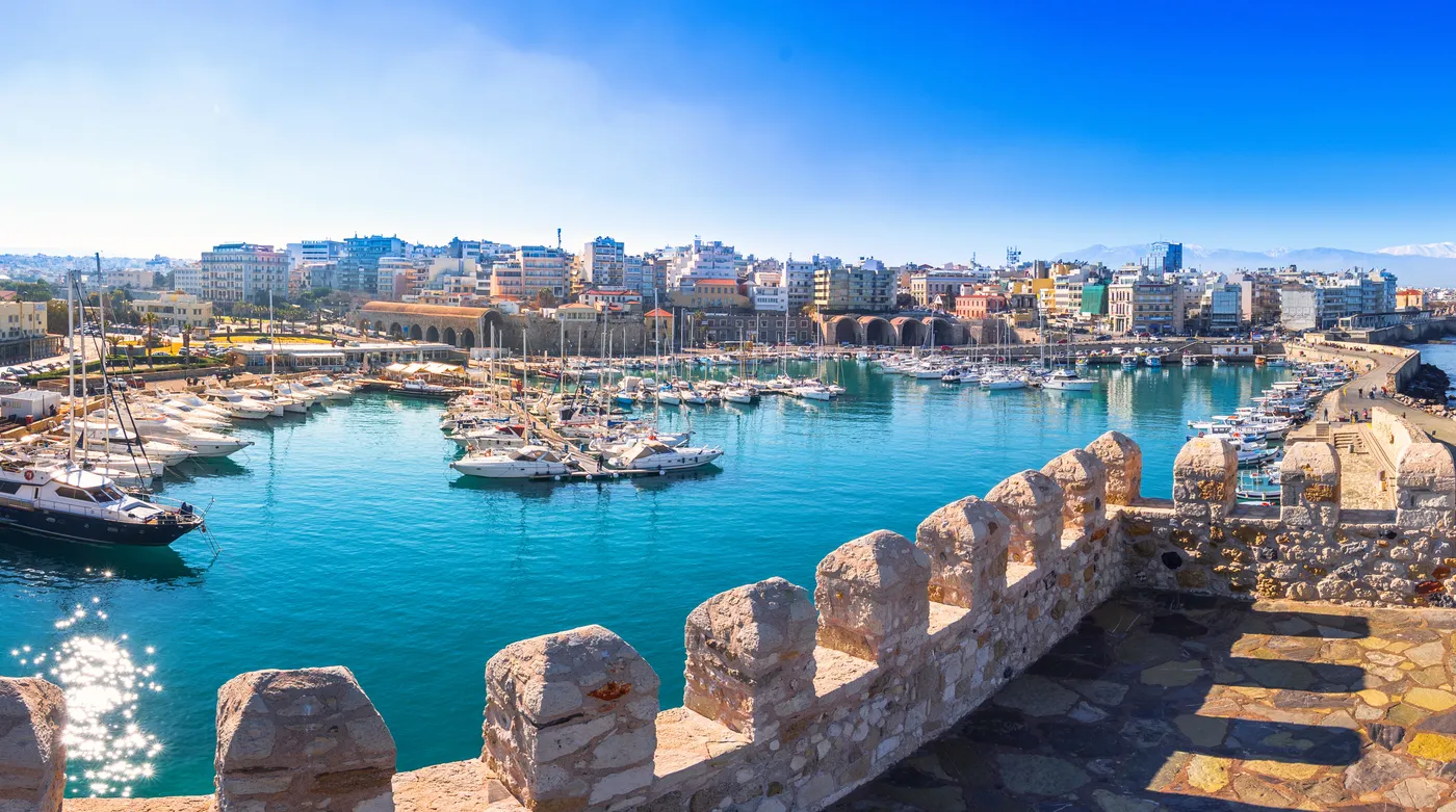 The old Venetian harbour of Heraklion from the fortress wall, masts against the city