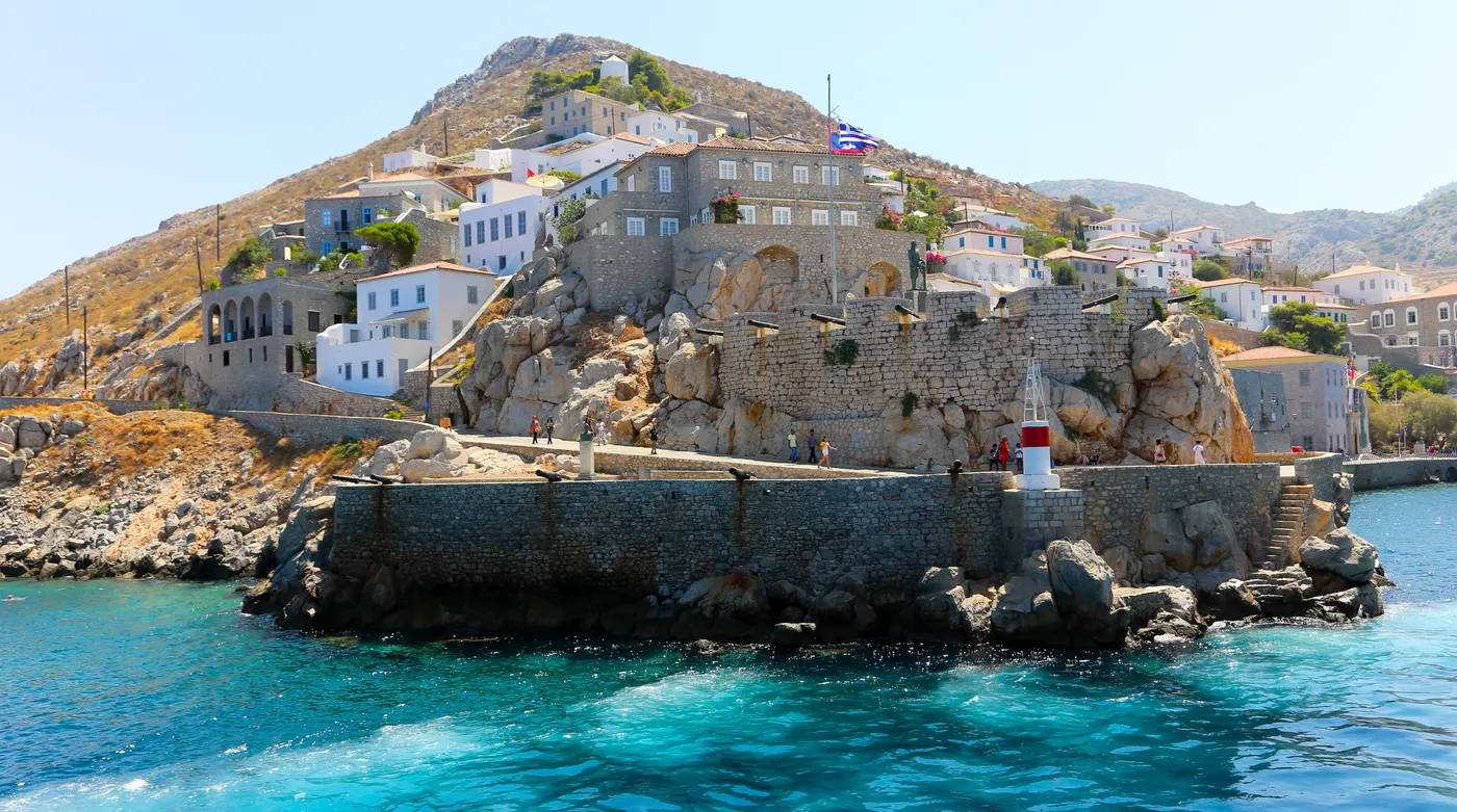 A stone bastion with cannons at a harbour mouth in the Saronic