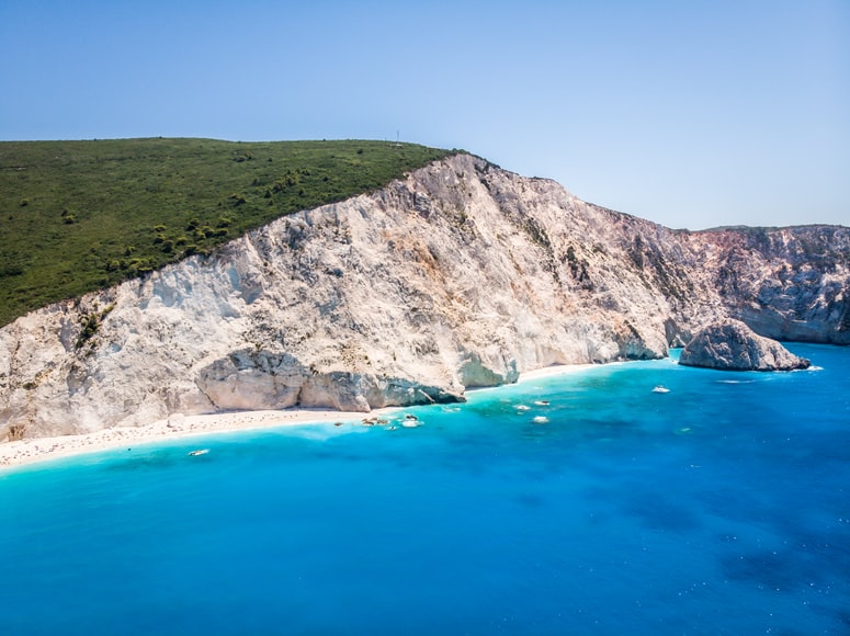 blue water and white sand beach greece